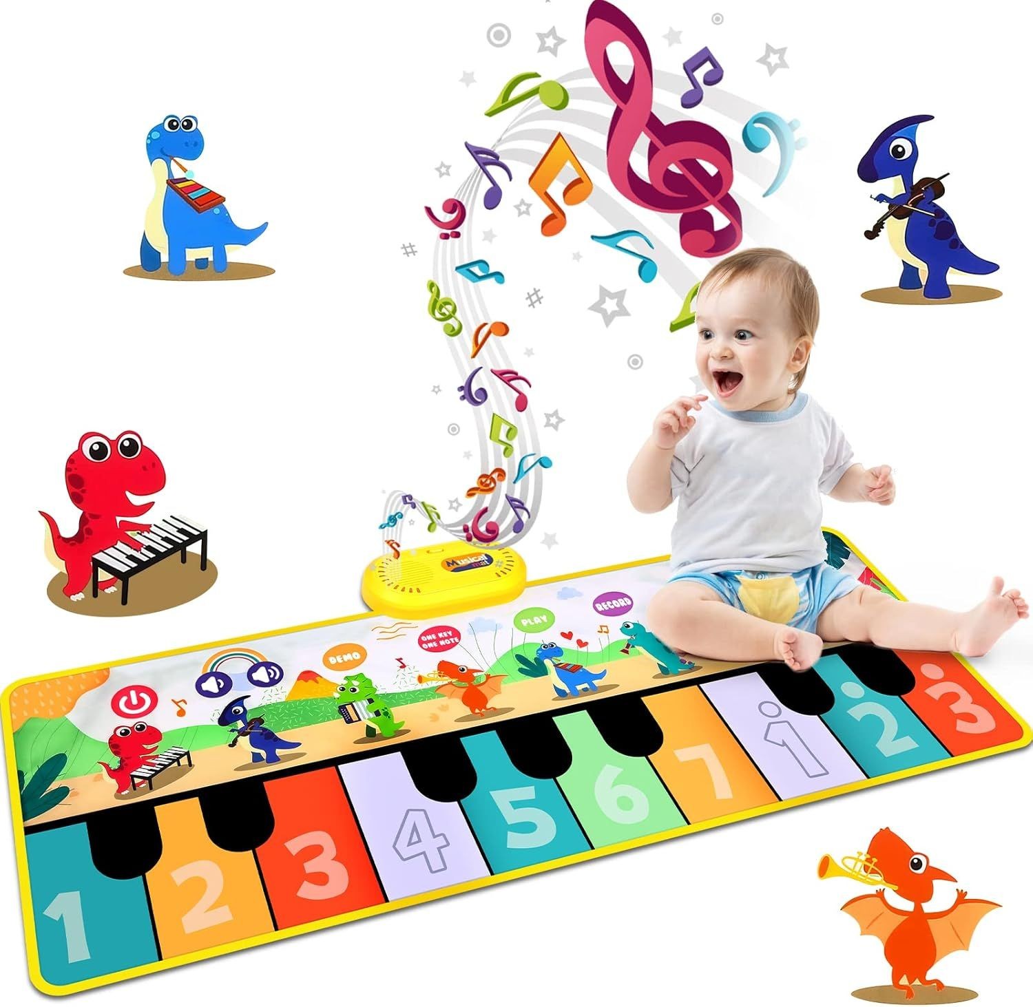 Baby sitting on a colorful piano play mat with cartoon dinosaurs and musical notes.