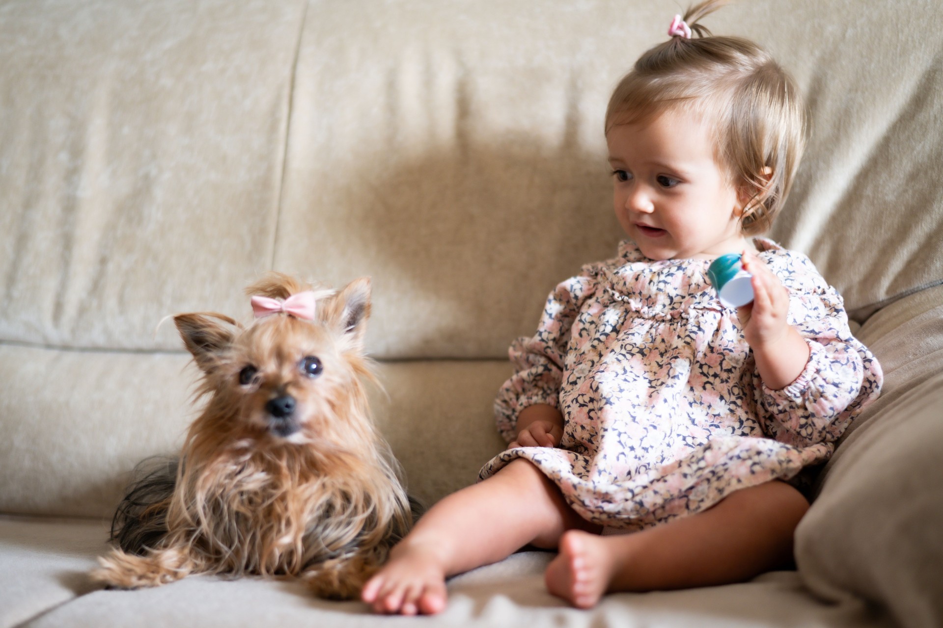 Happy Baby Making Funny Gestures With Pet Dog.